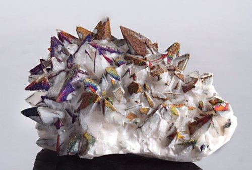 hematitehearts: Iridescent Metallic Chalcopyrite over Calcite Size: 5.5 x 4 x 3 inchesLocality: Ed