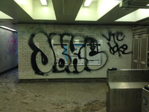 Graffiti at the Spaulding entrance of the Logan Square Blue Line stop.