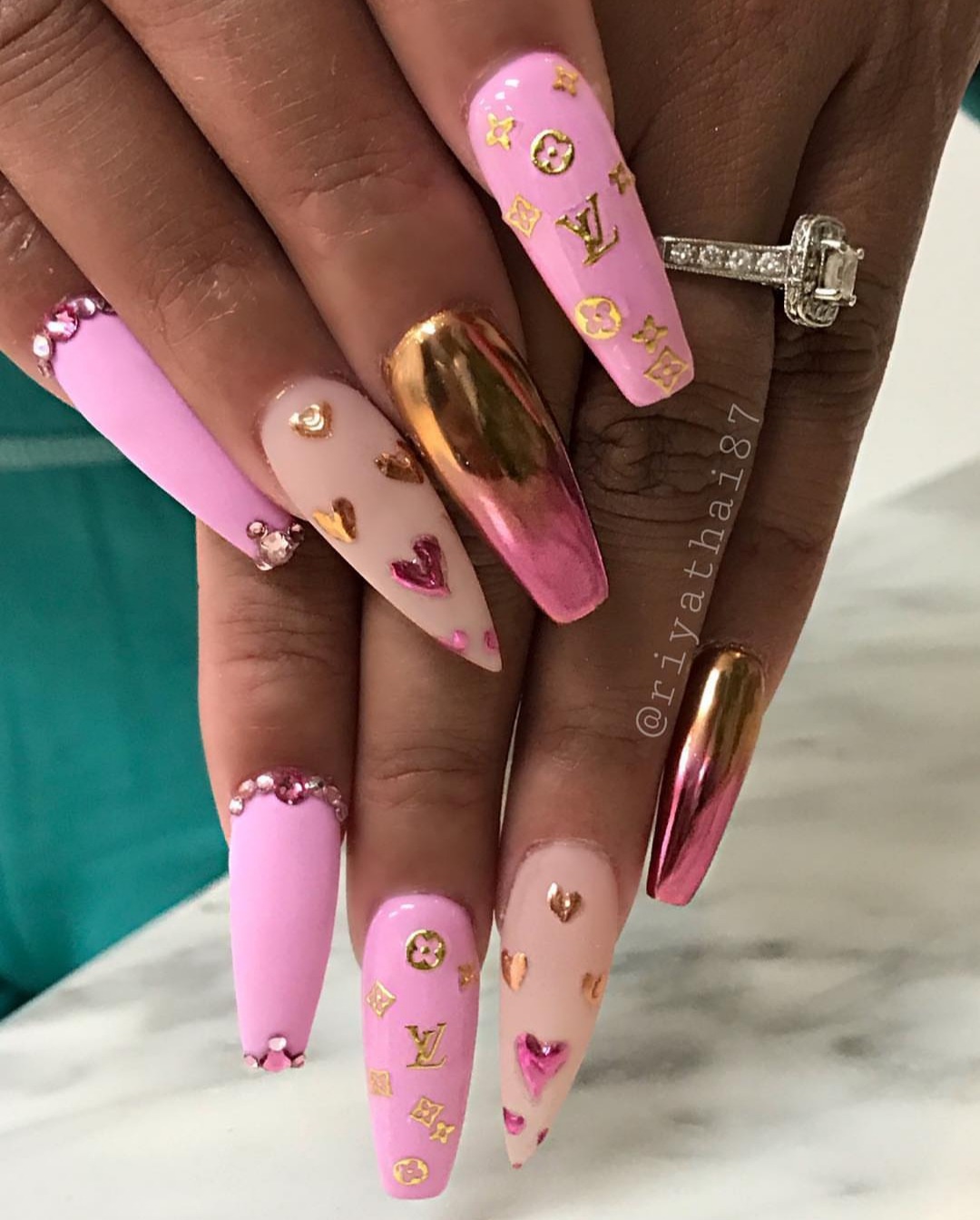 Pink louis vuitton nails 