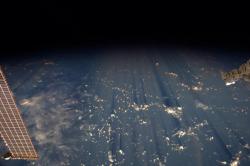 spaceexp:  Clouds cast thousand-mile shadows into the black of space.