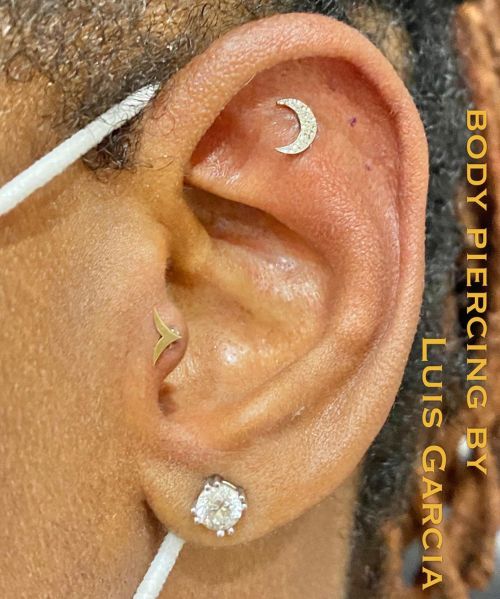 Fresh flat piercing with an 18kt white gold hammered moon and a tragus upgrade to an 18kt yellow gol