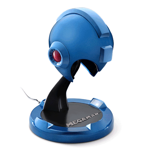 gamefreaksnz:  Mega Man Helmet US ๳.99 Ok, so the Mega Man Helmet is not really made to be worn; it’s all for show. But what a show! The base features USB-powered LEDs, which shine up to illuminate the removable helmet. But the cool thing is, when