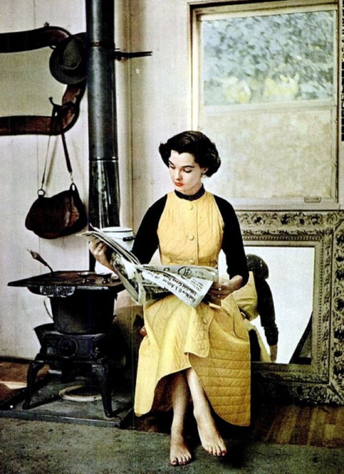Nan Rees reading in a quilted housecoat with fitted top that can be worn bare-armed by John Weitz, p