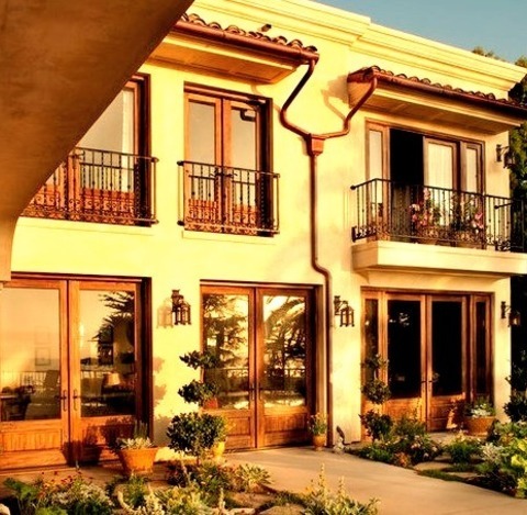 Example Of A Large Tuscan Beige Two-story Stucco Exterior Home Design