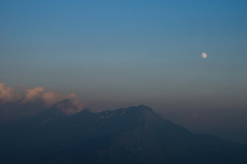 Kot Kandi mountain and waxing moon at dusk. Indian Himalayas