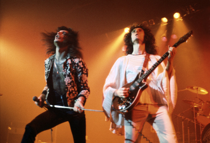 Freddie Mercury and Brian May of Queen on stage in 1974