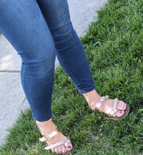 Birkenstock styled sandals on pretty feet.