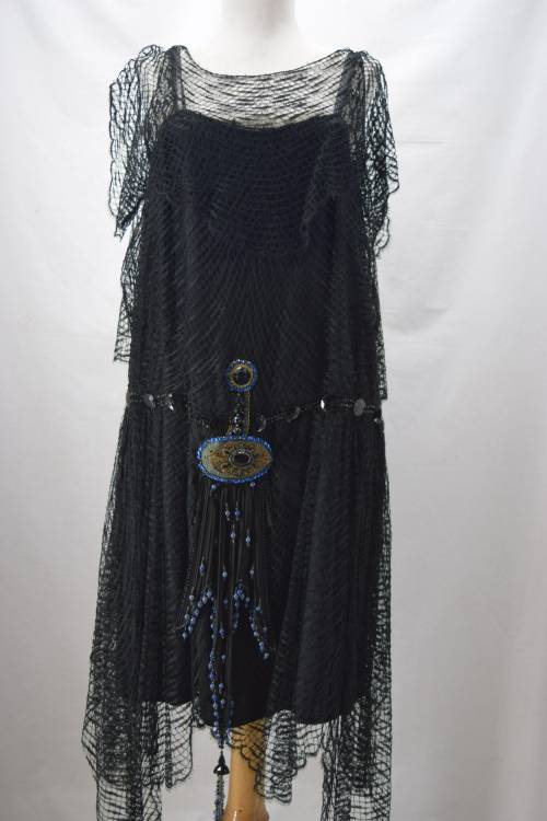 the1920sinpictures: 1926 c. Evening dress of spider web lace over a solid underdress. From Denise Ry