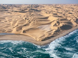 lushclub:  sixpenceee:   This is where where the Namib Desert meets the Atlantic Ocean.  Image by Roberto Sysa Moiola    L//C 