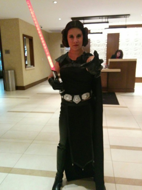 mellopetitone:[Image description: A woman stands in a hotel lobby, dressed in a cosplay of Leia as a