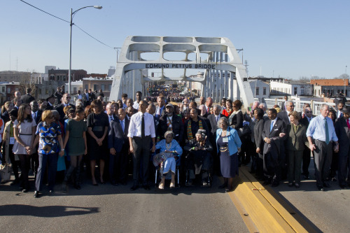 celebritiesofcolor:  President Barack Obama, first lady Michelle Obama, Malia and Sasha as well as members of Congress and civil rights leaders make a symbolic walk across the Edmund Pettus Bridge, Saturday, March 7, 2015, in Selma, Ala