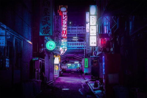 Dark neon-lit alleyway.