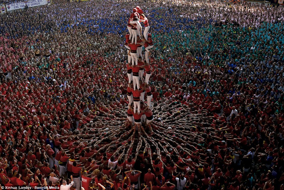 sixpenceee:  Participants build castells of human towers during the 25th Castells