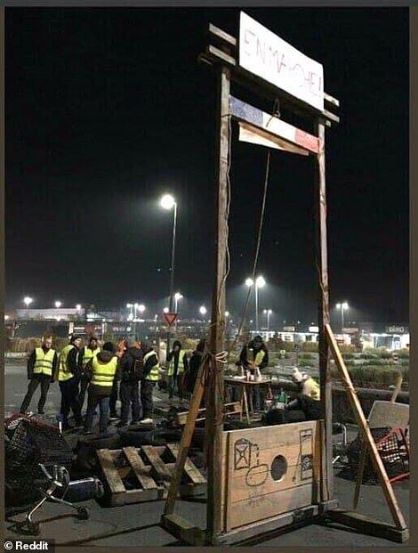 atomic58-blog:Yellow Vest protesters erect a GUILLOTINE bearing French President’s political party n
