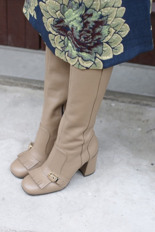 Fringed and buckled boots