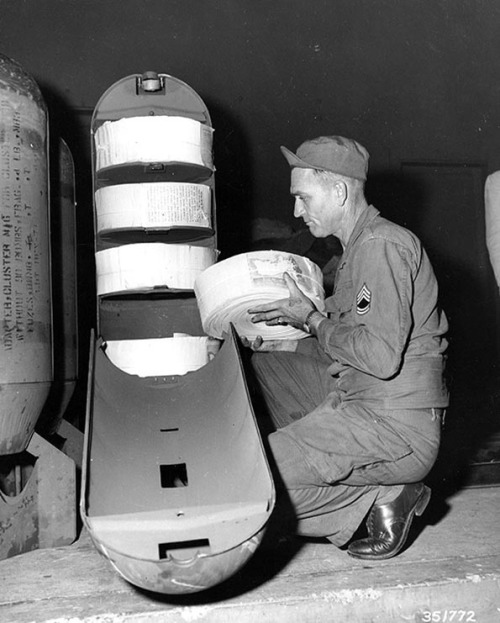 This is a photo of sergeant first class (SFC) loading an American propaganda leaflet bomb. It contai