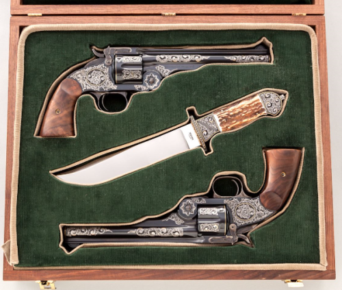 A cased and engraved set of Smith and Wesson No. 3 Schofield single action revolvers.Sold at Auction
