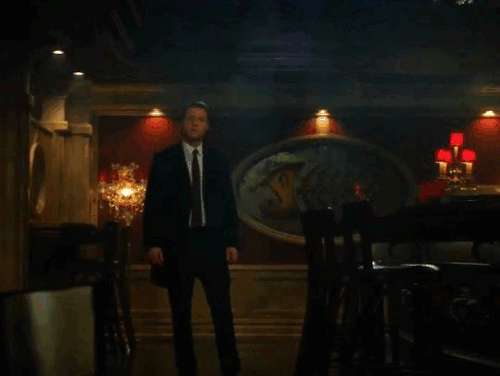 jim walks into oswald's bar and oswald says 'jim!', smiling, before taking off his party hat