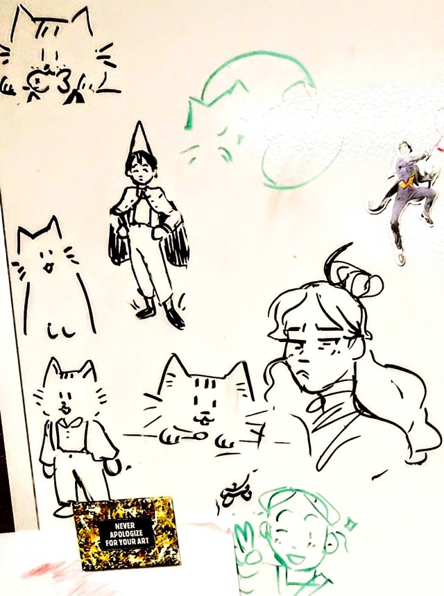 A whiteboard doodle of Katara, Wirt, and various cats.