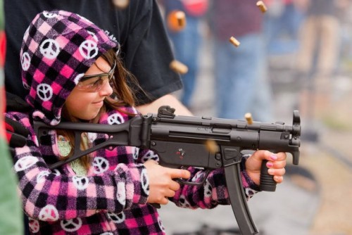 sexygungirls:  This kinda reminds me of Full Metal Jacket Colonel: Little girl, what are you doing here? Girl: Firing an H&K submachine gun on full auto, sir Colonel: What is that all over your hoodie? Girl: Peace symbols, sir Colonel: You’re firing