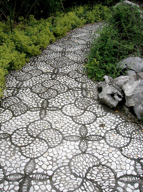 asylum-art:  10 Magical Pebble Paths That Flow Like Rivers   The garden or back-yard is one of the best places in a home for the home-owner to express their creative side. Why surround all those beautiful plants with an ugly path when you can create a