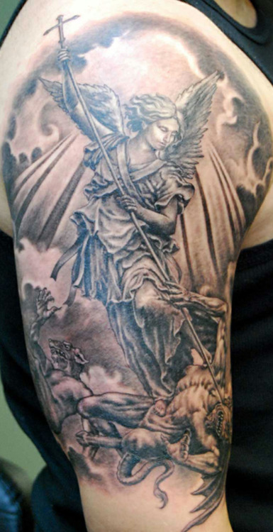 Beautiful tattoo of Archangel Michael defeating the demon