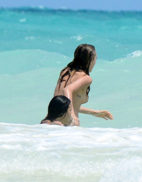 toplessbeachcelebs:  Michelle Rodriguez (Actress) and Cara Delevinge (Model) in a bikini and topless in Cancun (March 2014) 