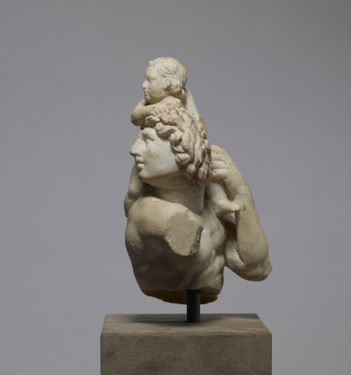 A satyr with the child Dionysus.  Artist unknown (thought to have been carved by craftsmen from