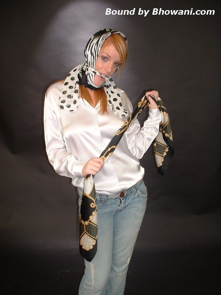 graybandanna:  A headscarfed Fi Stevens gags herself with 2 more scarves 