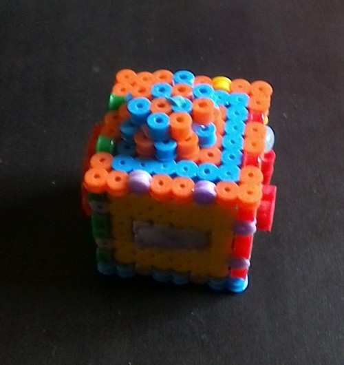 Fidget cube made from perler beads, with this tutorial [ x ]