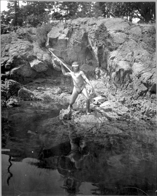 thebigkelu:Lummi man spearing a fish probably on San Juan or other islands of Puget Sound or on nearby mainland in Washington State. - Kiser - 1924