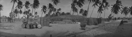 Hundreds of cases of &ldquo;MarylandWhiskey&rdquo; stacked on the beach, possibly Bimini, Bahamas, p