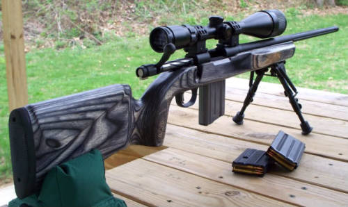 gunrunnerhell:  Mossberg MVP Predator A bolt-action rifle that takes AR-15 magazines (and drums), the MVP Predator has a wooden stock and 18” fluted barrel. The trigger is similar to the Savage Accu-Trigger and is adjustable. Although it uses AR-15