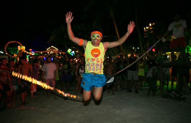 Thousands of people from around the world pack Haad Rin Beach, Koh Phangan, Thailand