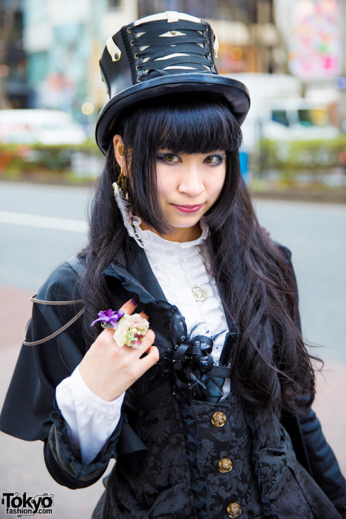 Japanese gothic lolita designer Ruru on the street in Harajuku wearing an H.Naoto jacket over a Blac