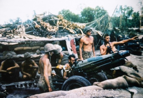  Artillerymen of the 3rd Marine Division, USMC, at the firing position of a 75mm Pack Howitzer M1 on