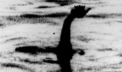 [image id] A grainy black and white photograph of the fabled Loch Ness Monster poking its head out of a lake, only its head is replaced with a superimposed silhouette of the Teapot. [end id]