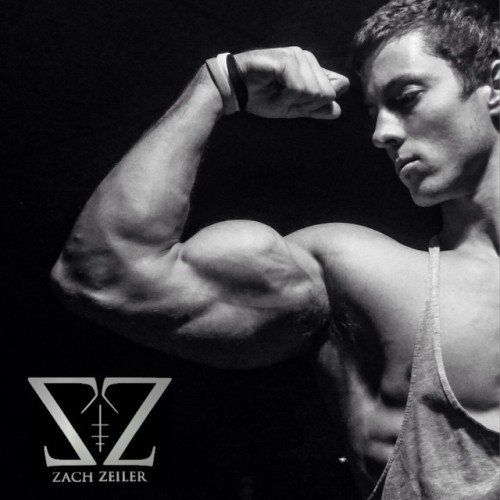 beautifulyoungmuscle:The stunning flexed biceps of Zach Zeiler. Piled high with muscle, studded with veins, rippling with mass and power, they’re erotic totems of beautiful young muscle.