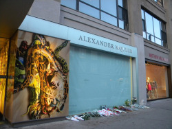 ilovemcqueen:  NEW YORK, Feb 12, 2010 – Flowers laid at the Alexander McQueen store at the  Meatpacking District. The British Designer died Feb 11, 2010 in his  London home. (Photo by Mari Davis / FashionWindows Network)