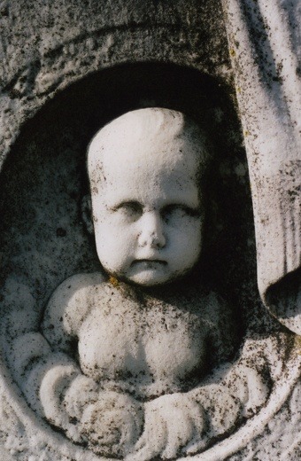 The Baby Faced Asylum Tombstone Near the center of Cedar Hill Cemetery is a large