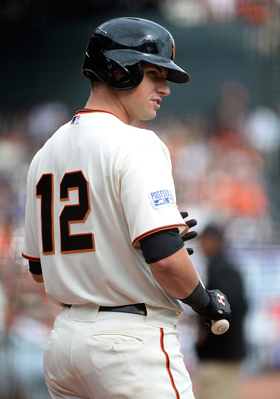 Joe Panik looks on before hitting in the first inning during Game Three of the National League Champ