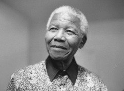 good:  Celebrating Nelson Mandela: Master of South Africa’s Fate  My first image of Nelson Mandela took the shape of an illegal portrait, spray-painted on a concrete wall surrounding a rugby field in George, South Africa. The year was 1984, I was eight