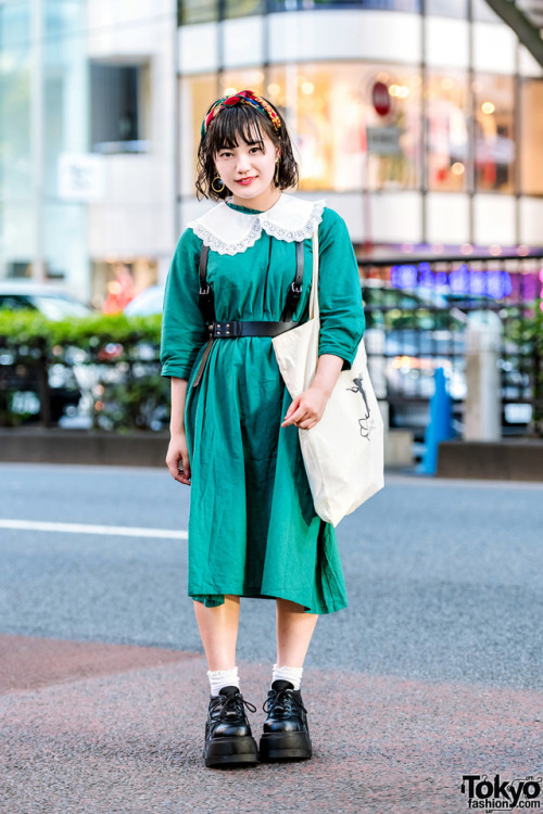 17-year-old Japanese student Moka on the street in Harajuku wearing a leather harness over vintage d