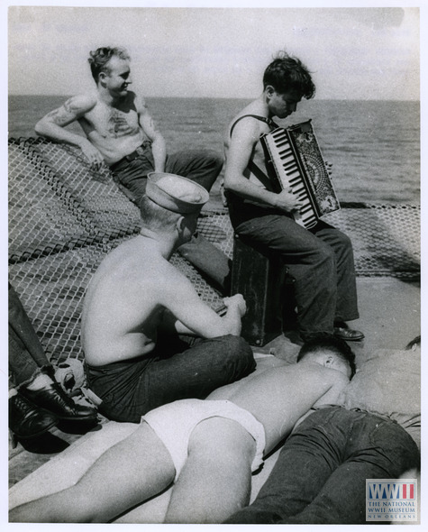 sailorgil:  “ The Accordion Player “  …   Crewmen listening to a musical