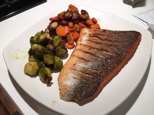 crispy salmon with roasted brussels sprouts and crispy garlic heirloom carrots