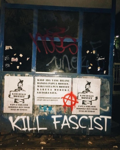 Anarchist graffiti and posters in solidarity with the West Papuan liberation struggle seen in Tanger