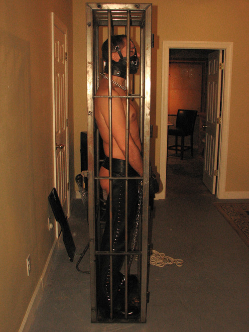workingsofatwistedmind:  sdspitbull:  steellock:  How long can you keep a man in one of these? Any ideas guys?  I will answer that, since I was his Captor. I kept him locked in the standing cage for as long as I liked, and then I moved him to another