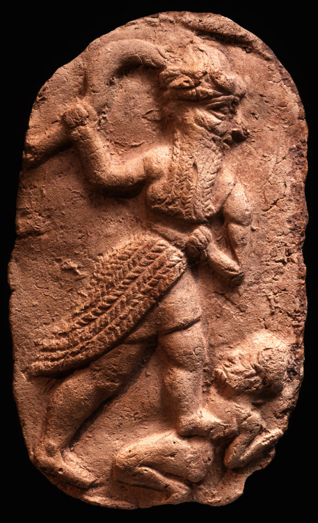 dwellerinthelibrary: &ldquo;Old Babylonian Terracotta Plaque: God with Sword smiting Enemy (Meso