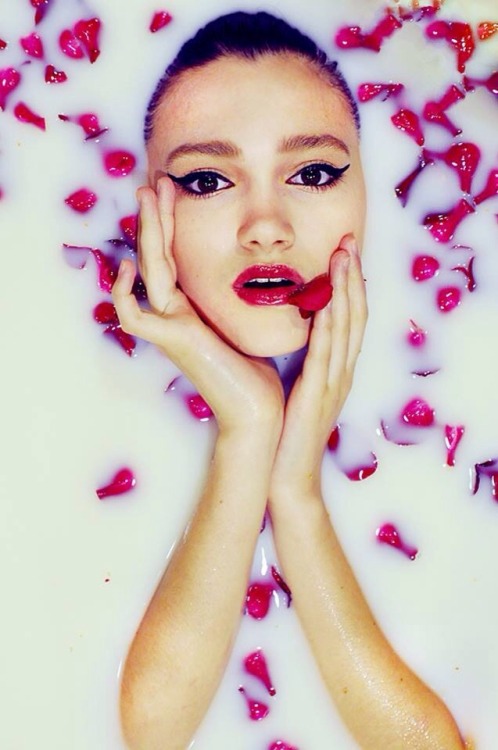 Terezka in my bathtub filled with pretty flowers and soya milk