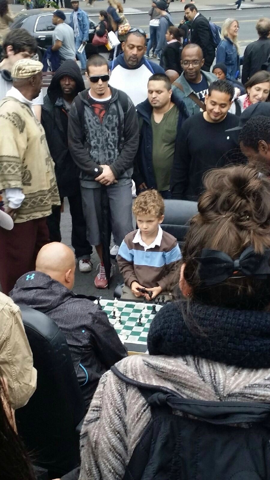 stunningpicture:  A crowd gathering in Union Square caught my attention. The kid